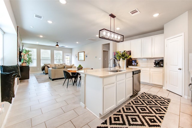 17715 White Lightning Way, Spring, TX 77379 - kitchen with dishwasher, ceiling fan, white cabinetry, backsplash, and recessed lighting