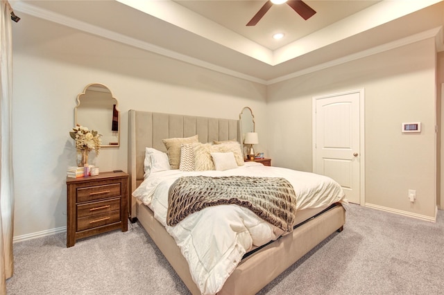 17715 White Lightning Way, Spring, TX 77379 - bedroom with light carpet, a ceiling fan, ornamental molding, a tray ceiling, and recessed lighting