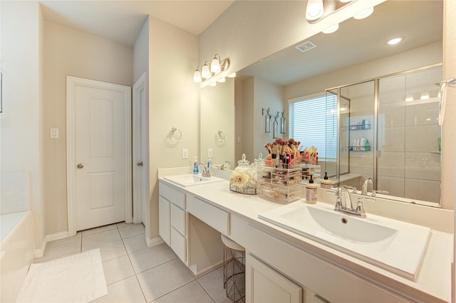 17715 White Lightning Way, Spring, TX 77379 - bathroom featuring tile patterned floors, double vanity, a stall shower, and a bath