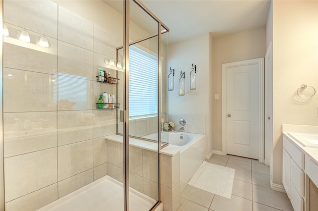 17715 White Lightning Way, Spring, TX 77379 - full bathroom with tile patterned floors, a garden tub, vanity, and a stall shower