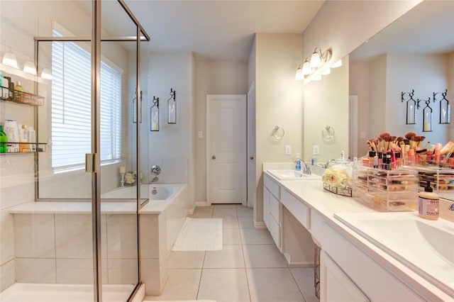 17715 White Lightning Way, Spring, TX 77379 - bathroom featuring a garden tub, double vanity, tile patterned floors, and a stall shower