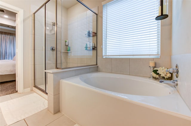 17715 White Lightning Way, Spring, TX 77379 - bathroom with connected bathroom, a bath, a shower stall, and tile patterned flooring
