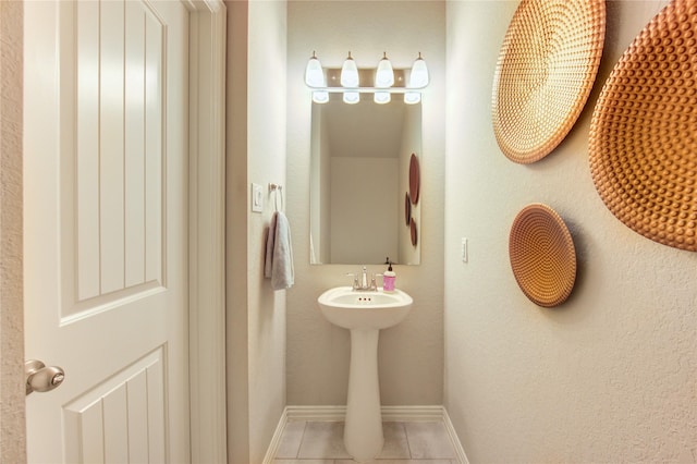 17715 White Lightning Way, Spring, TX 77379 - bathroom with baseboards and tile patterned flooring