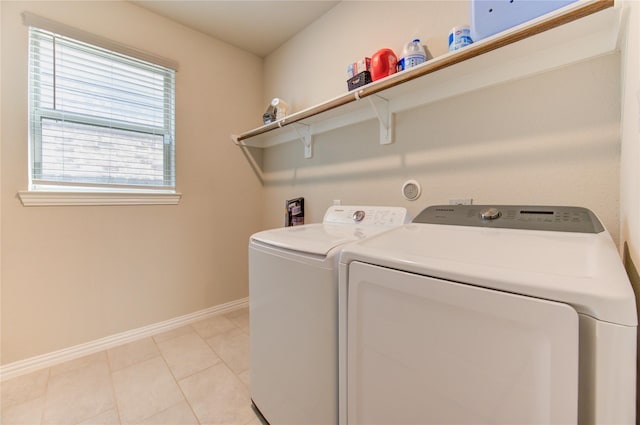 17715 White Lightning Way, Spring, TX 77379 - laundry area with separate washer and dryer and light tile patterned floors