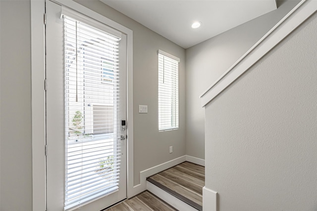 240 Julia St Unit D, Houston, TX 77022 - doorway featuring light wood-type flooring and plenty of natural light