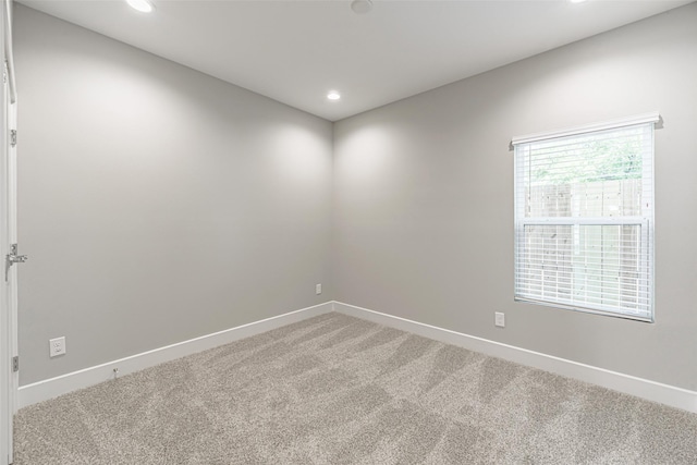240 Julia St Unit D, Houston, TX 77022 - empty room with light carpet and recessed lighting