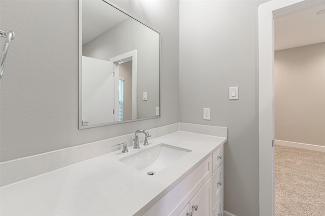 240 Julia St Unit D, Houston, TX 77022 - bathroom with vanity and baseboards