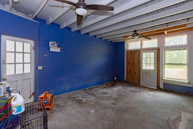 117 Pecan Dr, Baytown, TX 77520 - foyer entrance with ceiling fan, concrete floors, wooden walls, and beamed ceiling