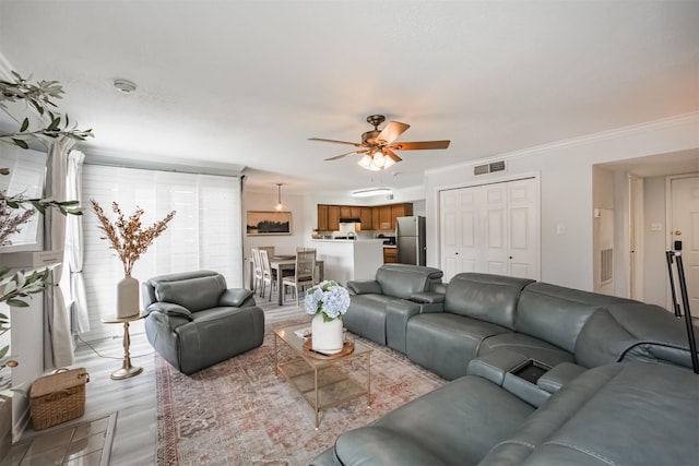 2300 Old Spanish Trl Unit 1060, Houston, TX 77054 - living room with a ceiling fan, light wood-style flooring, and ornamental molding