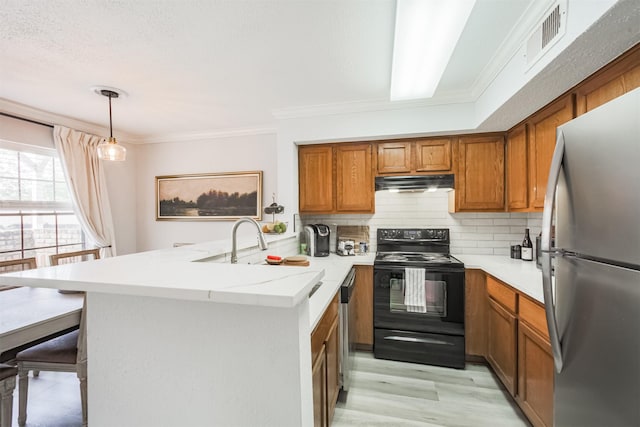 2300 Old Spanish Trl Unit 1060, Houston, TX 77054 - kitchen featuring appliances with stainless steel finishes, extractor fan, a peninsula, brown cabinets, and backsplash