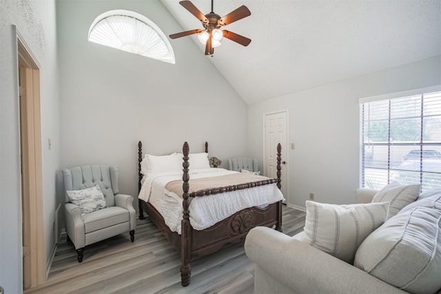 2300 Old Spanish Trl Unit 1060, Houston, TX 77054 - bedroom featuring multiple windows, light wood-style floors, high vaulted ceiling, and ceiling fan