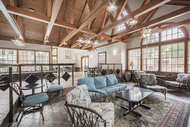 2300 Old Spanish Trl Unit 1060, Houston, TX 77054 - living area featuring high vaulted ceiling, stone finish flooring, and a wooden ceiling with exposed beams