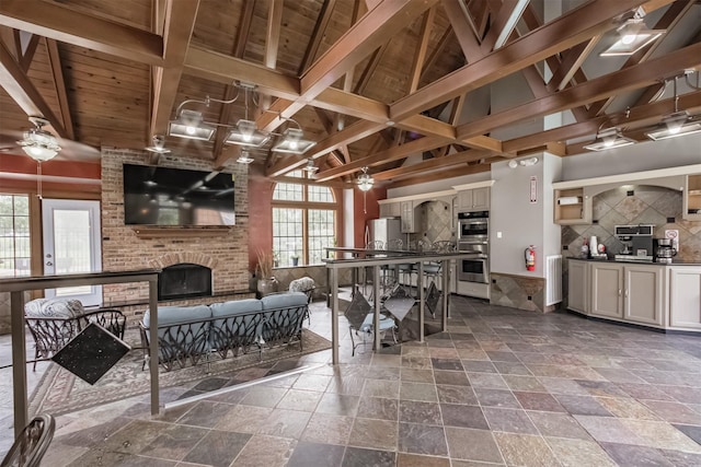2300 Old Spanish Trl Unit 1060, Houston, TX 77054 - living area with ceiling fan, healthy amount of natural light, stone tile floors, and wooden ceiling