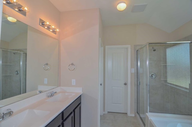 3634 Goldleaf Trail Dr, Katy, TX 77449 - bathroom featuring tile patterned floors, double vanity, a stall shower, lofted ceiling, and a bath