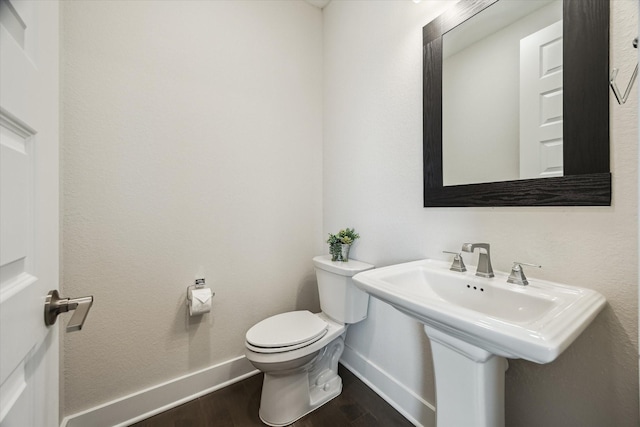14115 Garibaldi Dr, Cypress, TX 77433 - bathroom with baseboards and wood finished floors