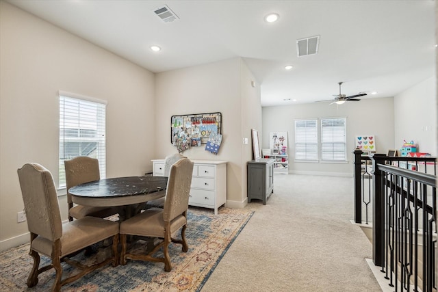 14115 Garibaldi Dr, Cypress, TX 77433 - dining space with light carpet, a ceiling fan, and recessed lighting
