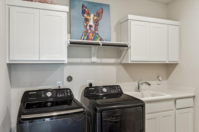 14115 Garibaldi Dr, Cypress, TX 77433 - laundry area with washing machine and dryer and cabinet space