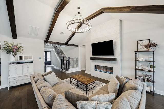 14115 Garibaldi Dr, Cypress, TX 77433 - living room with stairway, a chandelier, wood finished floors, and a fireplace