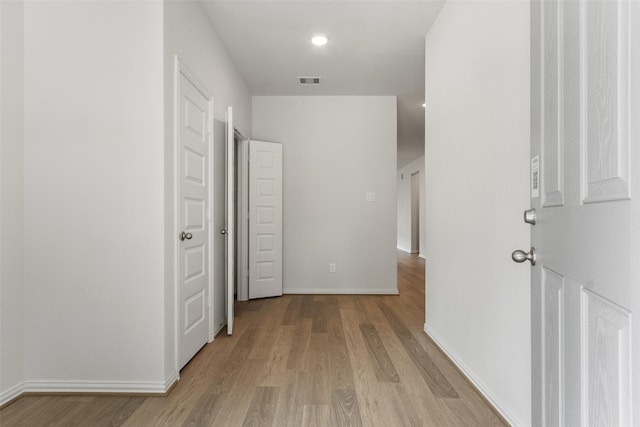 4402 Azalea Blossom Rd, Pinehurst, TX 77362 - corridor featuring light wood-style flooring and baseboards