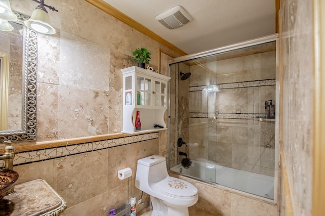 2019 Vanamen Ct, Conroe, TX 77304 - full bathroom featuring tiled shower / bath, tile walls, and crown molding