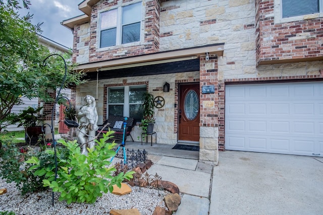 2019 Vanamen Ct, Conroe, TX 77304 - entrance to property with a porch, a garage, and stone siding