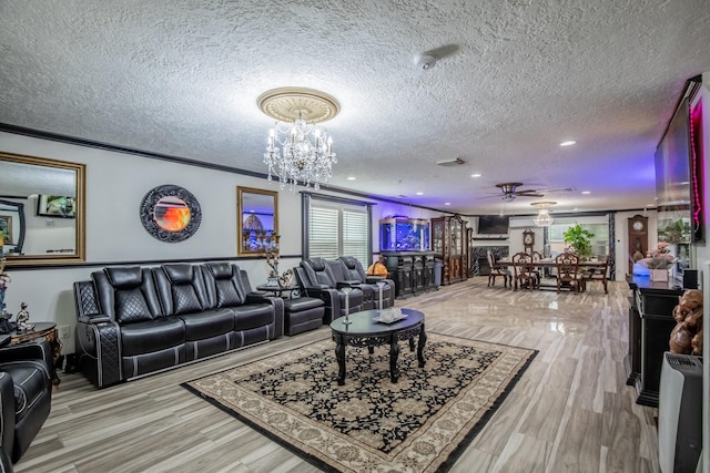 2019 Vanamen Ct, Conroe, TX 77304 - living area featuring a textured ceiling, ceiling fan, recessed lighting, a chandelier, and wood finished floors