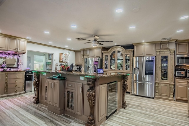 2019 Vanamen Ct, Conroe, TX 77304 - kitchen with appliances with stainless steel finishes, beverage cooler, glass insert cabinets, recessed lighting, and ceiling fan