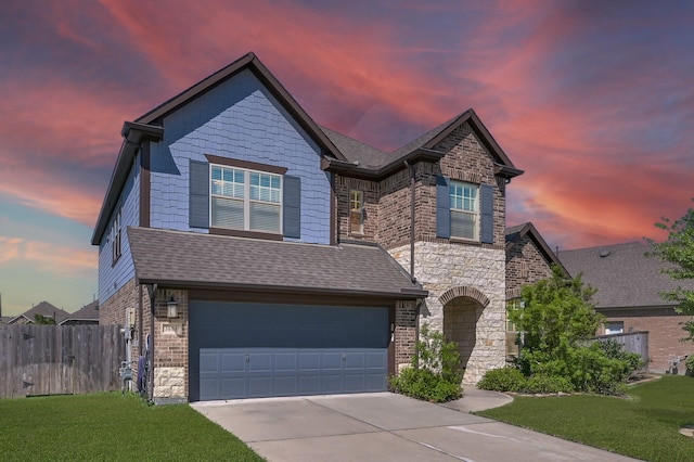 3604 Magnolia Crest Ln, Spring, TX 77386 - view of front of house featuring driveway, a garage, stone siding, and brick siding