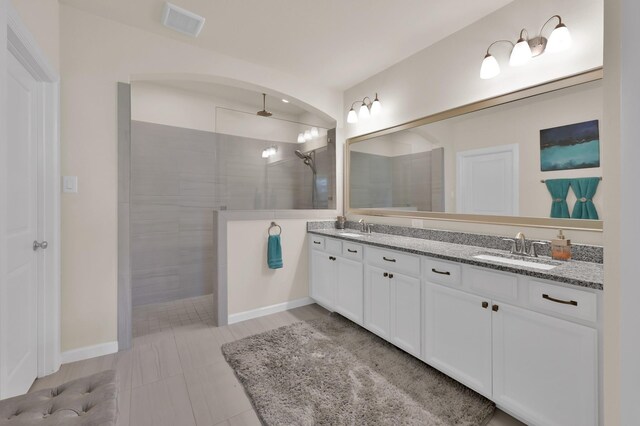 3604 Magnolia Crest Ln, Spring, TX 77386 - full bathroom featuring double vanity, walk in shower, and tile patterned flooring