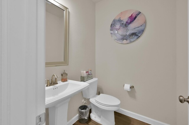 3604 Magnolia Crest Ln, Spring, TX 77386 - half bath featuring toilet and wood finished floors