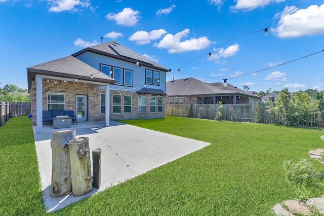 3604 Magnolia Crest Ln, Spring, TX 77386 - rear view of house with outdoor lounge area, brick siding, a fenced backyard, a patio area, and roof mounted solar panels