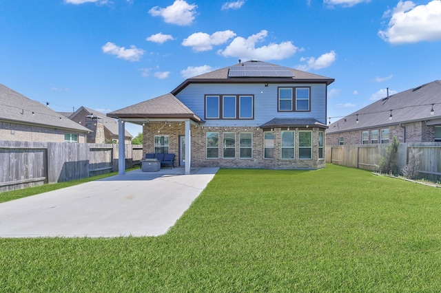 3604 Magnolia Crest Ln, Spring, TX 77386 - back of house with a patio, solar panels, a fenced backyard, and brick siding