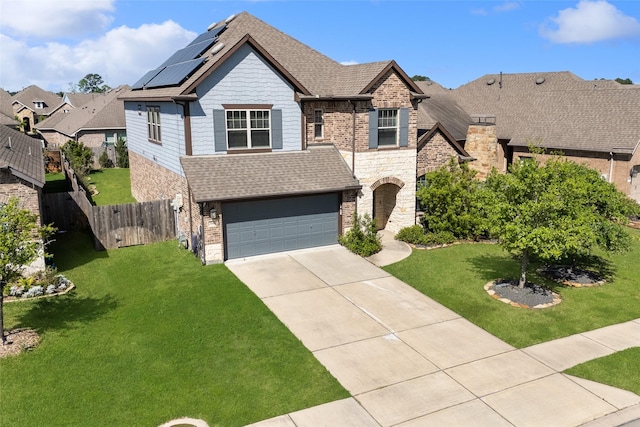 3604 Magnolia Crest Ln, Spring, TX 77386 - view of front of property with roof mounted solar panels, a garage, driveway, and a shingled roof