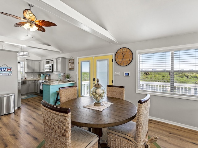 4039 San Jacinto Dr, Galveston, TX 77554 - dining area with french doors, dark wood-style flooring, and a ceiling fan