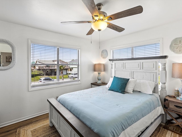 4039 San Jacinto Dr, Galveston, TX 77554 - bedroom featuring dark wood-type flooring and a ceiling fan