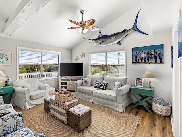 4039 San Jacinto Dr, Galveston, TX 77554 - living room featuring lofted ceiling, healthy amount of natural light, wood finished floors, and ceiling fan