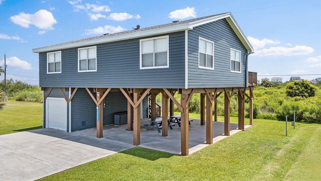 4039 San Jacinto Dr, Galveston, TX 77554 - beach home with driveway, a front lawn, and a garage