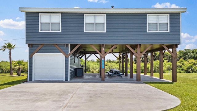 4039 San Jacinto Dr, Galveston, TX 77554 - view of community featuring a lawn, a carport, and a garage