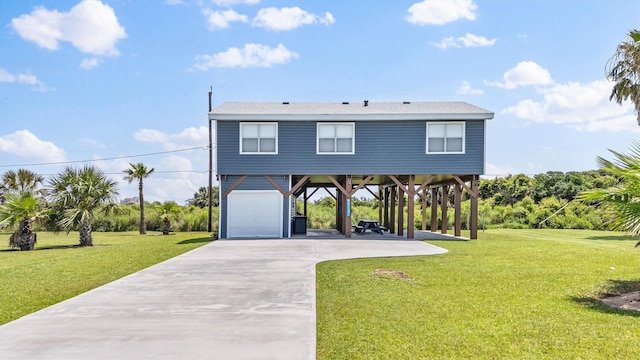 4039 San Jacinto Dr, Galveston, TX 77554 - raised beach house featuring a carport, a front yard, concrete driveway, and a garage
