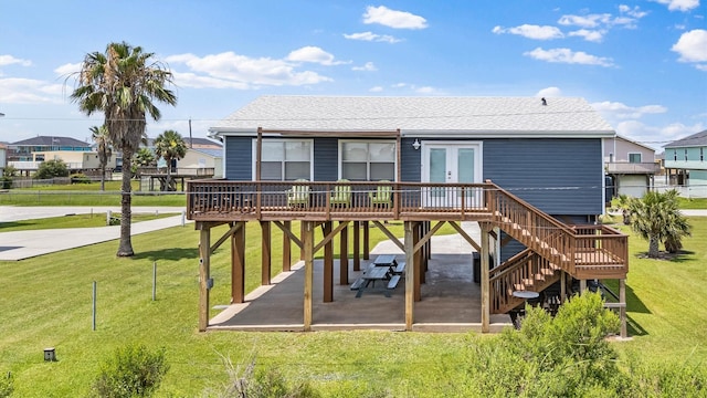 4039 San Jacinto Dr, Galveston, TX 77554 - rear view of house featuring a patio area, french doors, a deck, a yard, and stairway
