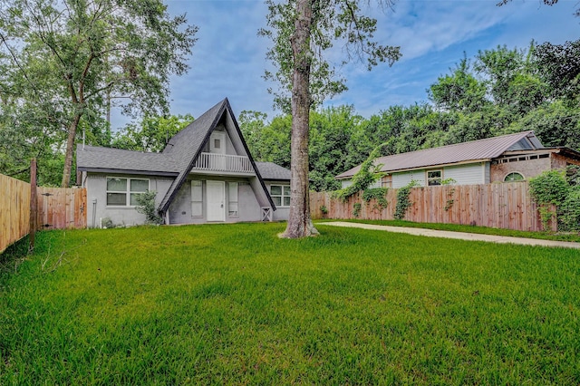 408 Commanche Rd, Conroe, TX 77316 - view of front of property with a fenced backyard, stucco siding, and a shingled roof