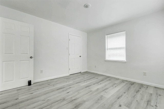 408 Commanche Rd, Conroe, TX 77316 - unfurnished bedroom with light wood-style flooring and baseboards