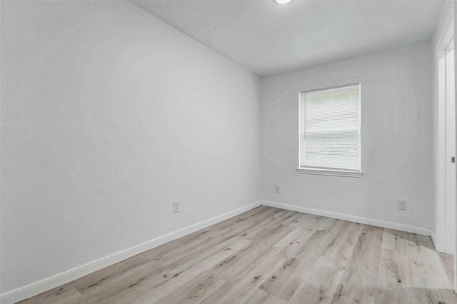 408 Commanche Rd, Conroe, TX 77316 - empty room featuring light wood-style floors and baseboards
