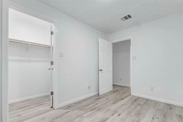 408 Commanche Rd, Conroe, TX 77316 - unfurnished bedroom with wood finished floors and a closet