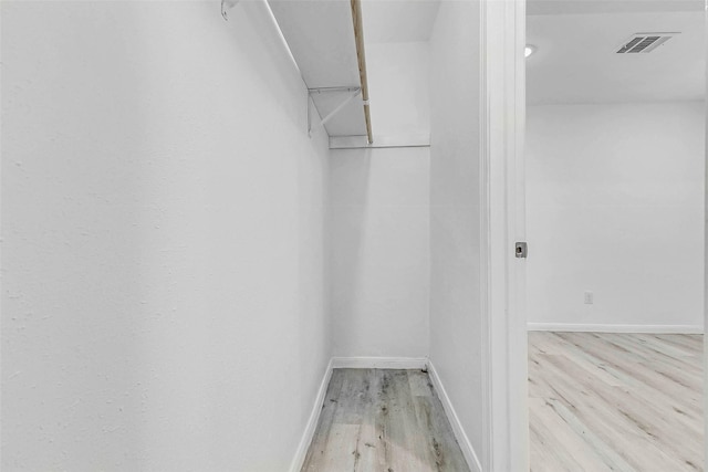 408 Commanche Rd, Conroe, TX 77316 - spacious closet featuring wood finished floors