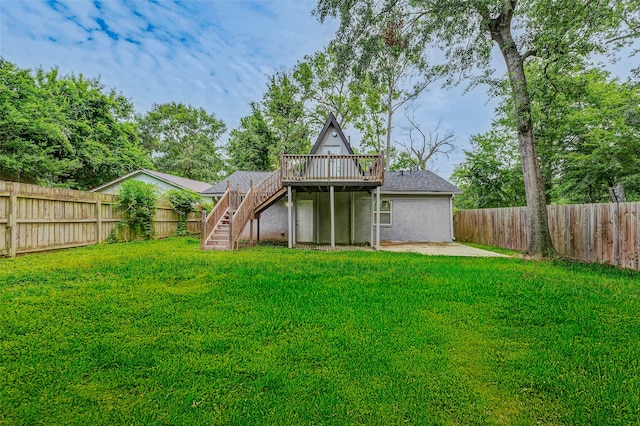 408 Commanche Rd, Conroe, TX 77316 - rear view of house featuring a fenced backyard, stairs, a wooden deck, stucco siding, and a patio area