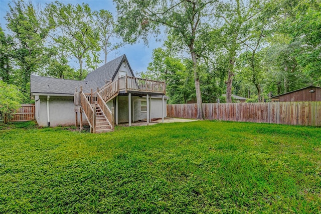 408 Commanche Rd, Conroe, TX 77316 - fenced backyard featuring stairs and a deck