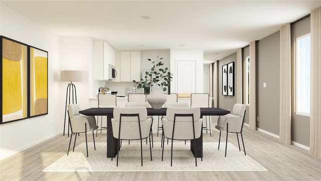 3009 Wild Dunes Dr, Katy, TX 77493 - dining space with light wood finished floors and healthy amount of natural light