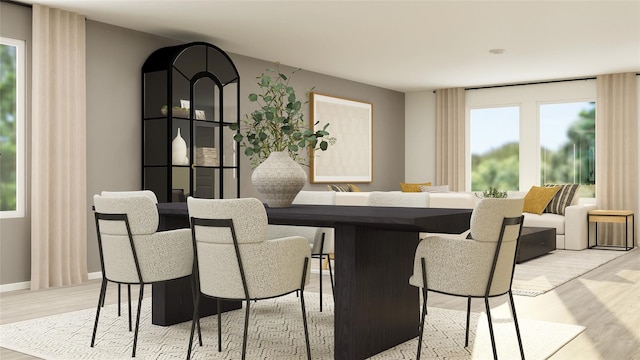 3009 Wild Dunes Dr, Katy, TX 77493 - dining area featuring light wood finished floors and baseboards