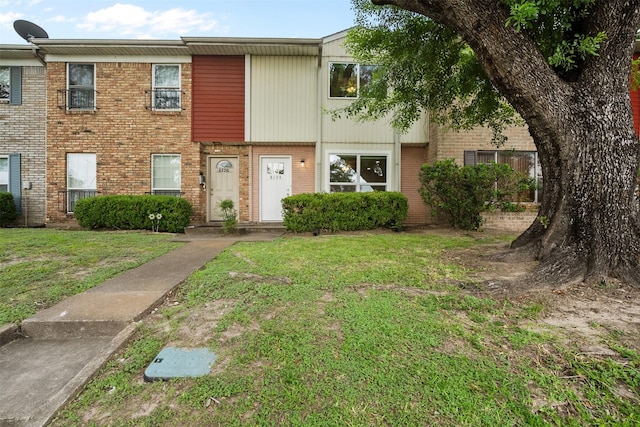 8124 Fondren Rd Unit 8124, Houston, TX 77074 - townhome / multi-family property with brick siding and a front yard